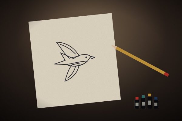 A swallow sketch on paper next to a pencil and ink bottles